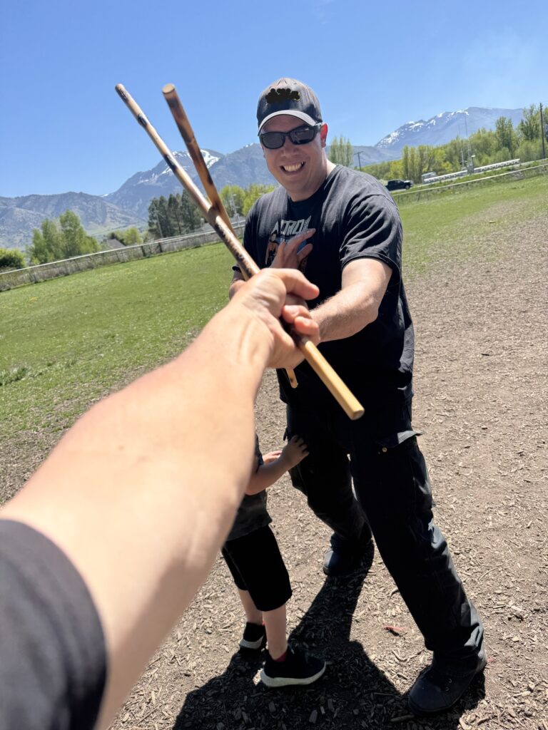 Tuhon Brandon crossing sticks with Grand Tuhon Nate.